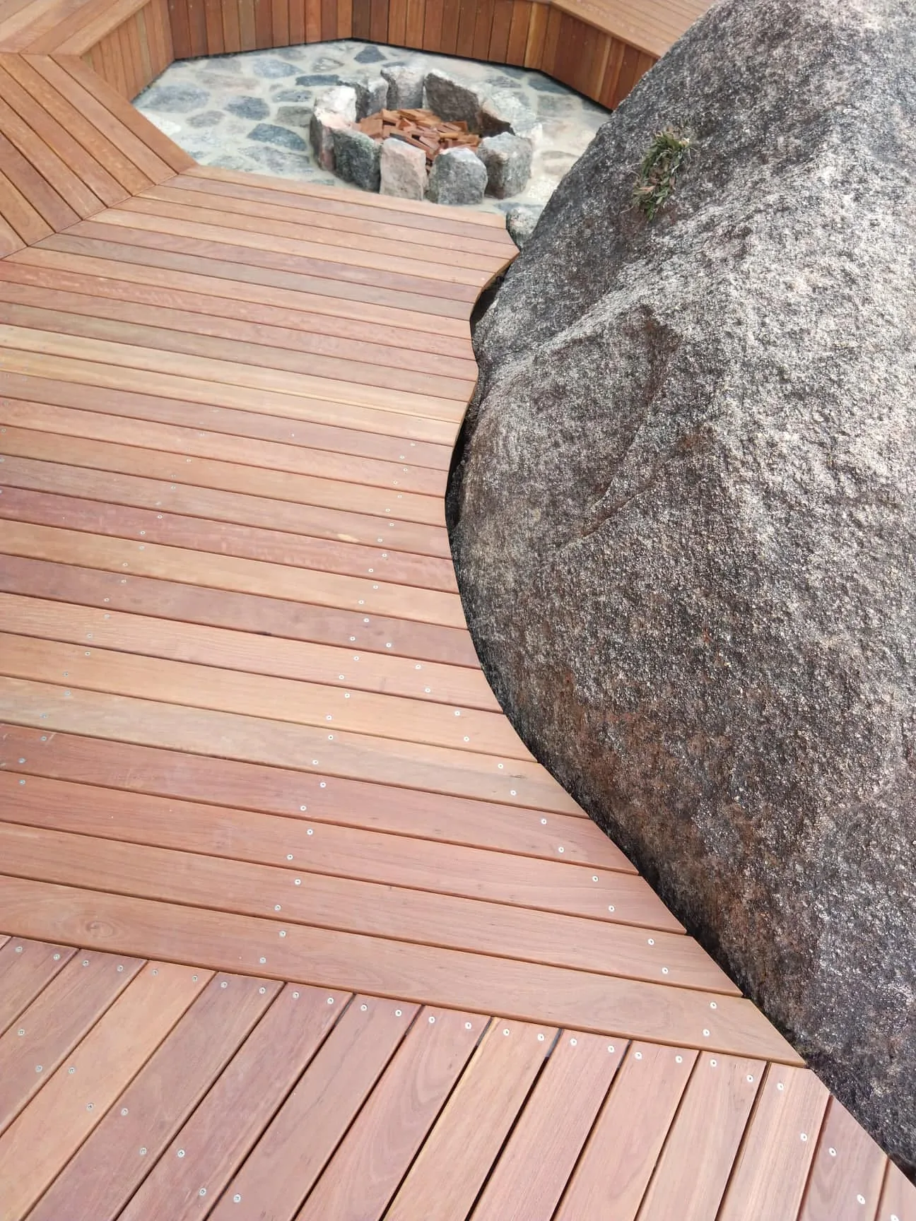 Ironbark deck built around a granite boulder